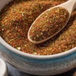 Close-up of Hillbilly Fish Seasoning in a bowl with a spoon (2)